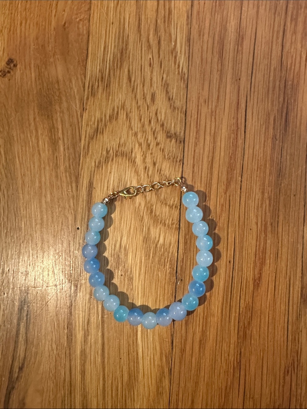Blue Beaded Bracelet with Gold Chain Accent